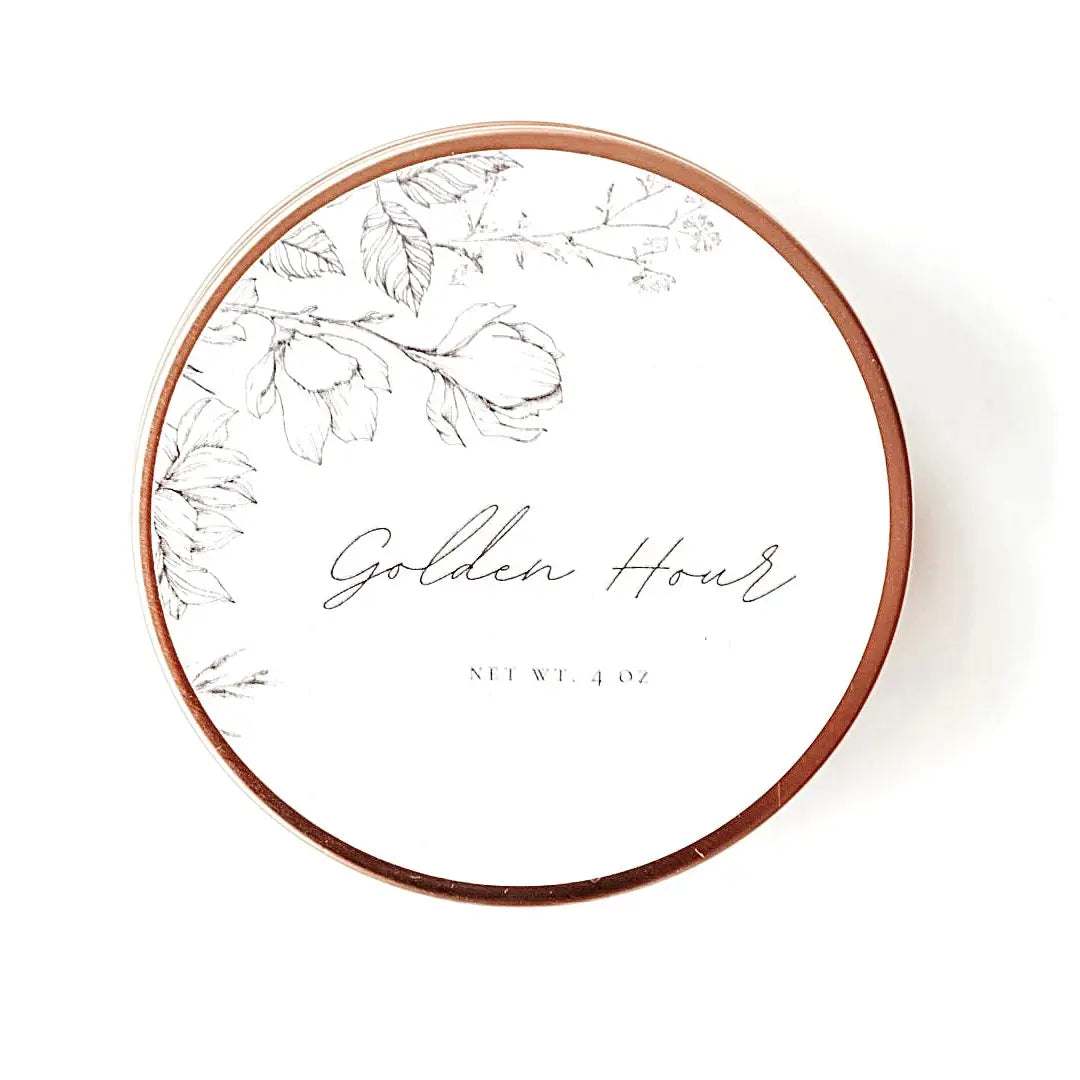 Golden Hour Travel Candle in a sleek 4oz tin with warm citrus and amber scent