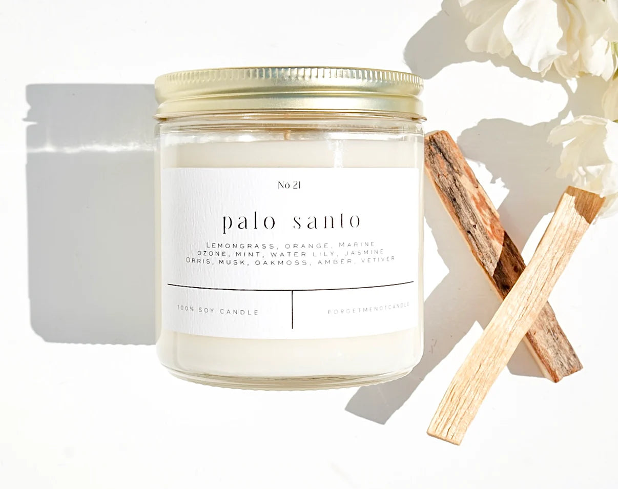 Palo Santo 9oz 100% Soy Candle in a minimalist glass jar with earthy, calming aroma.